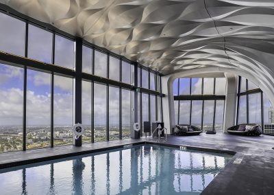 Photograph of the indoor pool at One Thousand Museum condo.